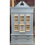 A large painted doll's house style bedroom cabinet over two drawers, W. 125, H. 220cm.