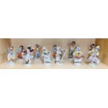 A set of eleven Dresden porcelain monkey band figures, H. 23cm, (A/F to top of bassoon)