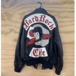An original Hard Rock café leather jacket by Satin Jackets Inc. A Stormin' Norman Production, size