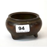 An interesting old Chinese cast bronze censer, Dia. 11cm, H. 6cm.