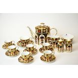 A Royal Crown Derby tea and coffee set comprising; tea pot, sugar bowl, milk jug, one tea cup and