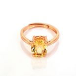 A rose gold on 925 silver solitaire adjustable ring set with an oval cut citrine, (N.5).