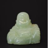 A small Chinese carved jade figure of a seated Putai, W. 5cm, H. 4.5cm.
