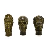 Three interesting walking cane handles, tallest H. 8cm.