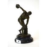 A cast bronze figure of a discus thrower after Myron on a grey marble base, H. 26cm.