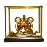 A cased brass fusee skeleton clock, case size 39 x 26 x 36cm.