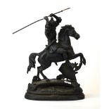 A large antique cast iron figure of a medieval knight on horseback, H. 51cm.