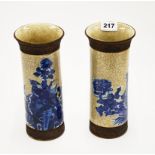 A pair of Chinese hand painted and crackle glazed porcelain cylinder vases, H. 26cm.