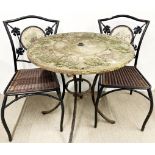 A vintage garden table and two chairs.