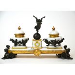 An attractive bronze and gilt bronze mounted marble desk stand, W. 29cm, H. 18cm.