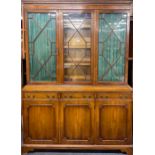 A Regency style mahogany veneered bookcase, W. 150cm, H. 200cm.