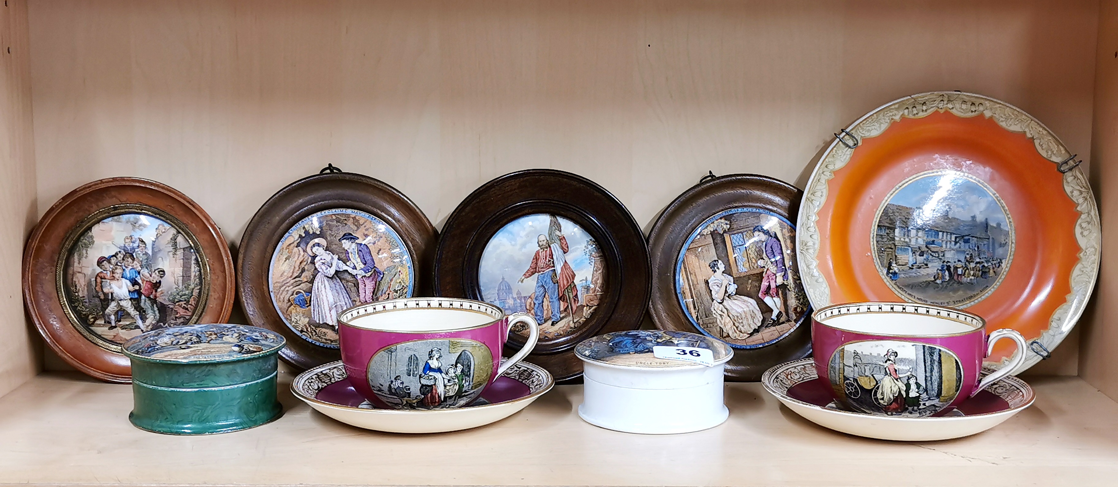 A group of 19th century Pratt ware pot lids and plate, with a pair of Addams Cries of London cups