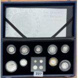 A 2006 Queen Elizabeth 80th birthday collection of 9 cased silver coins together with Maundy money.