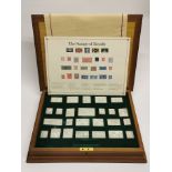 A cased set of silver stamps of Royalty commemorative medals.