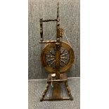 A handmade spinning wheel, H. 115cm.