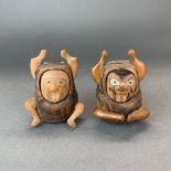 Two Japanese carved wooden Kabuki figures with detachable faces, H. 10cm.