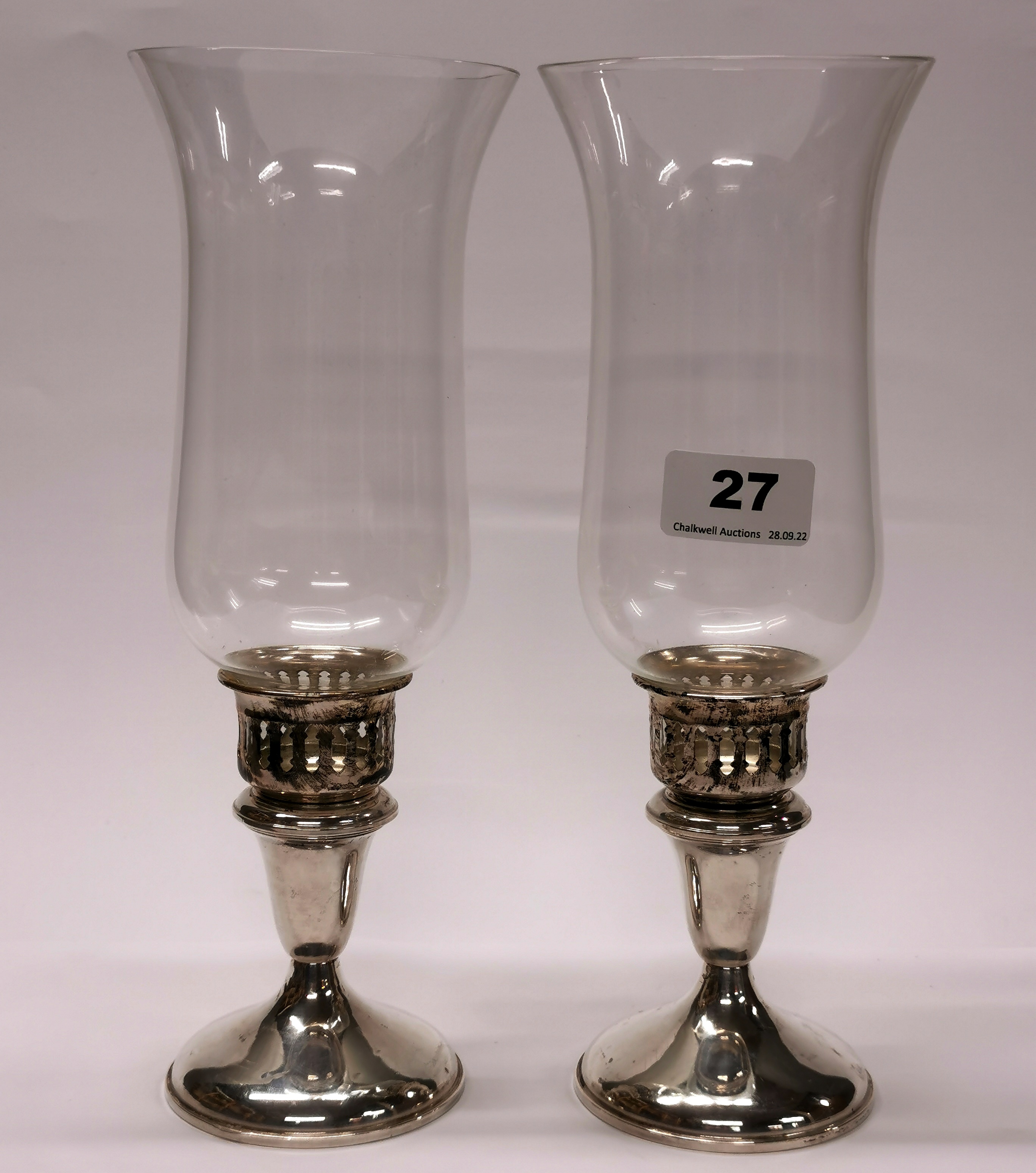 A pair of sterling silver based storm lanterns, H. 27cm.