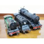 A group of three 'O' gauge model locomotives.