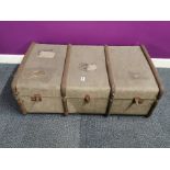 A vintage trunk, metalware contents including pairs of binoculars.