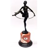 An Art Deco style bronze figure of a girl with a hoop on a marble base, H. 48cm.
