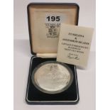A cased Royal Mint Saint Helena fine silver twenty five pound commemorative proof coin.