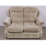 A comfortable upholstered settee.