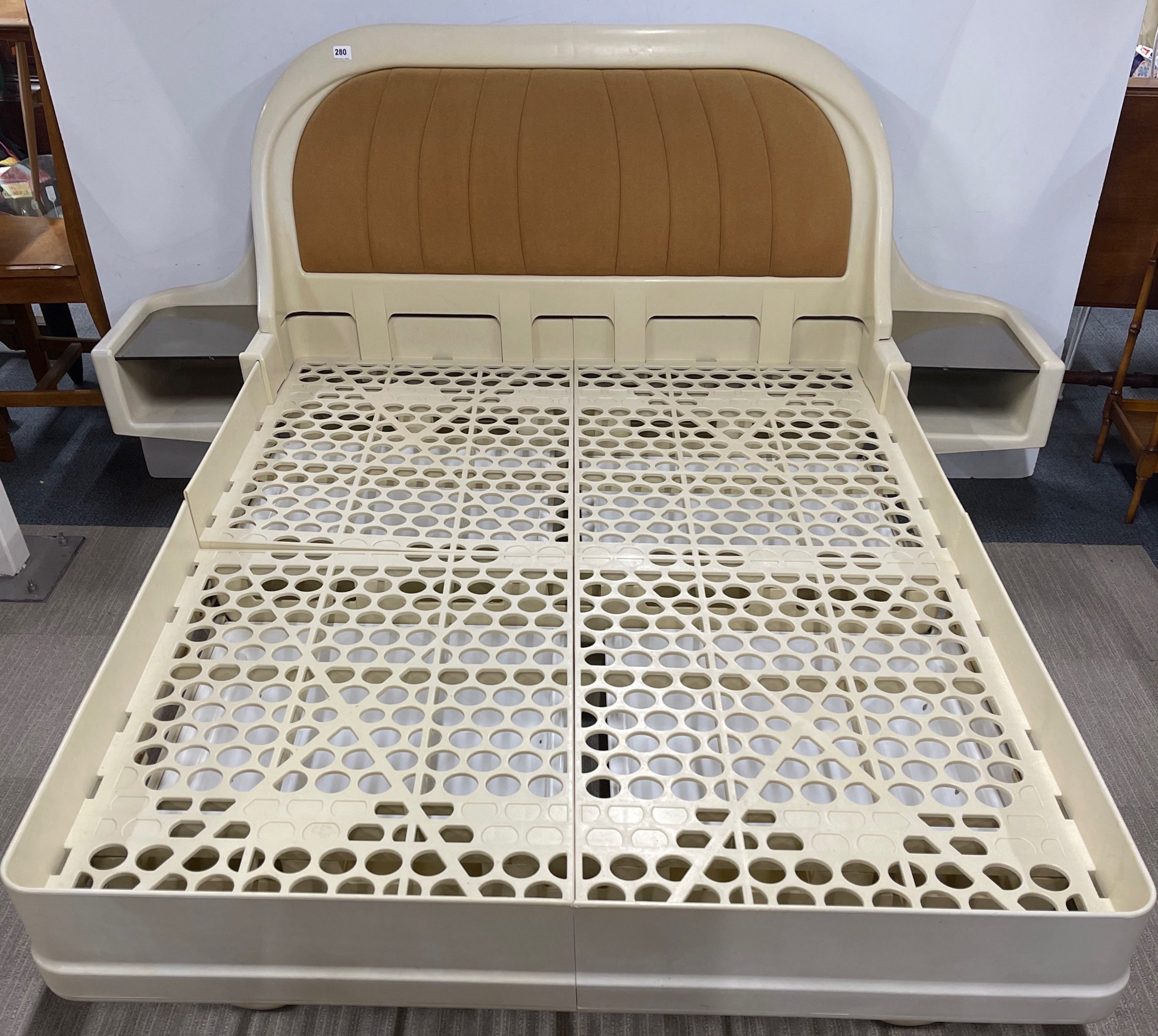 A 1970's plastic double bed frame