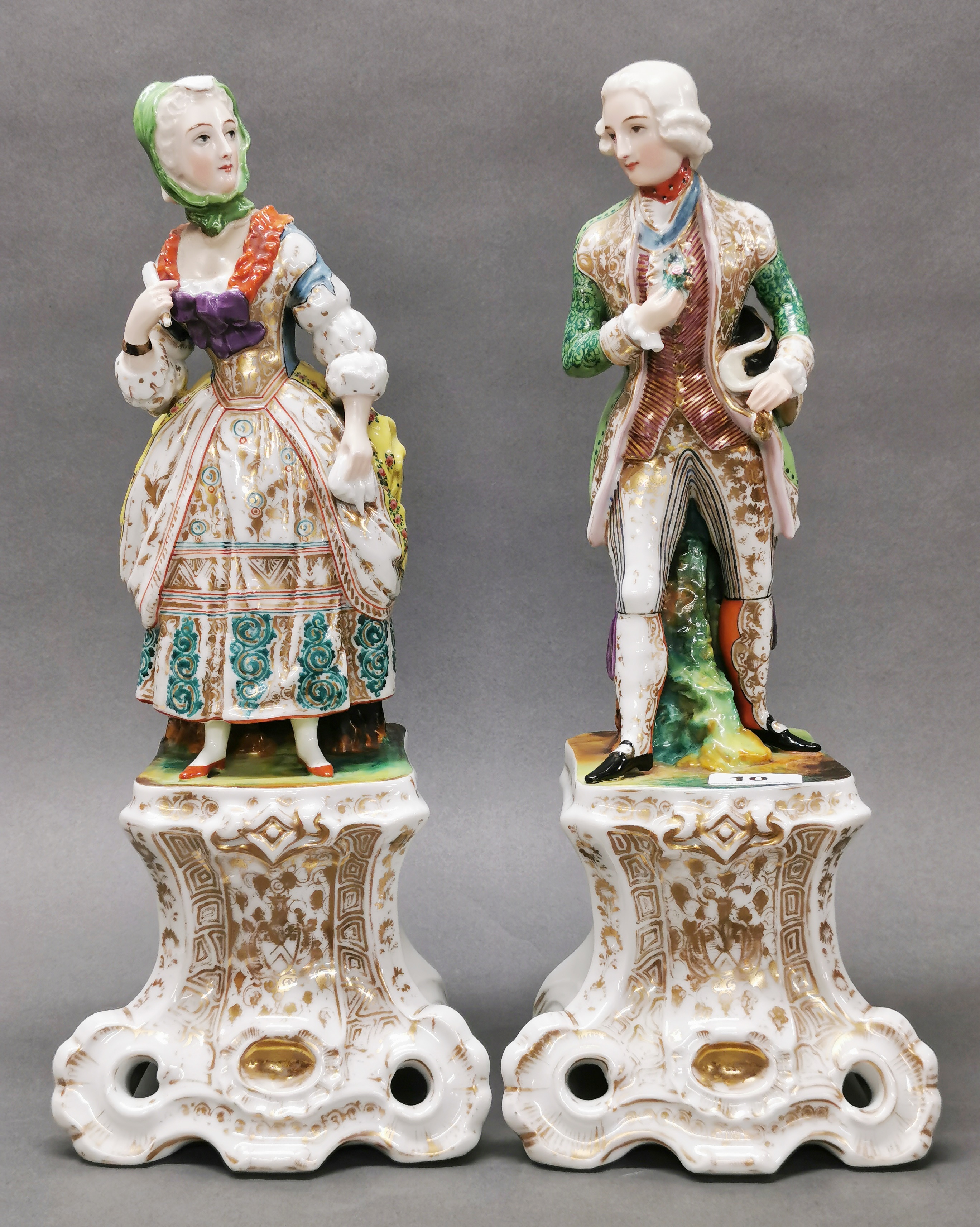 A pair of large 19th century French porcelain figurines, H. 45cm. (Woman restored at neck).