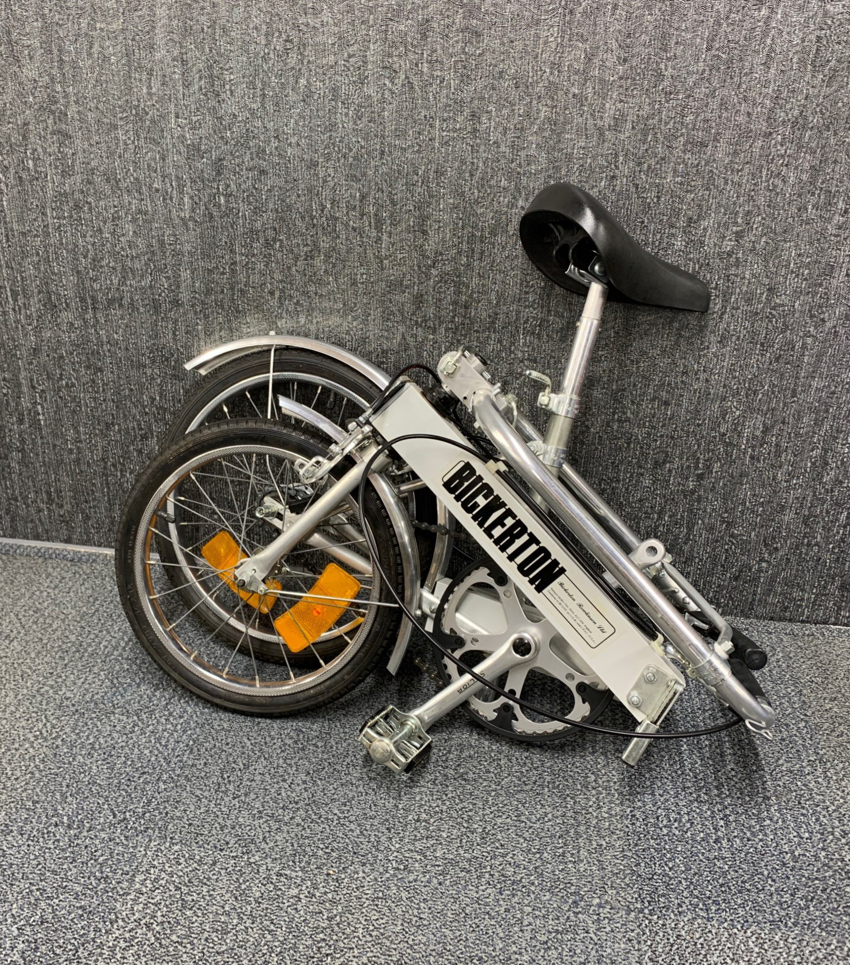 A vintage folding Bickerton aluminium bicycle with original bag.