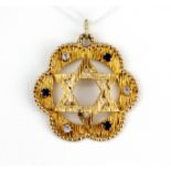 A 9ct yellow gold Star of David pendant set with white and blue spinels, L. 3cm.