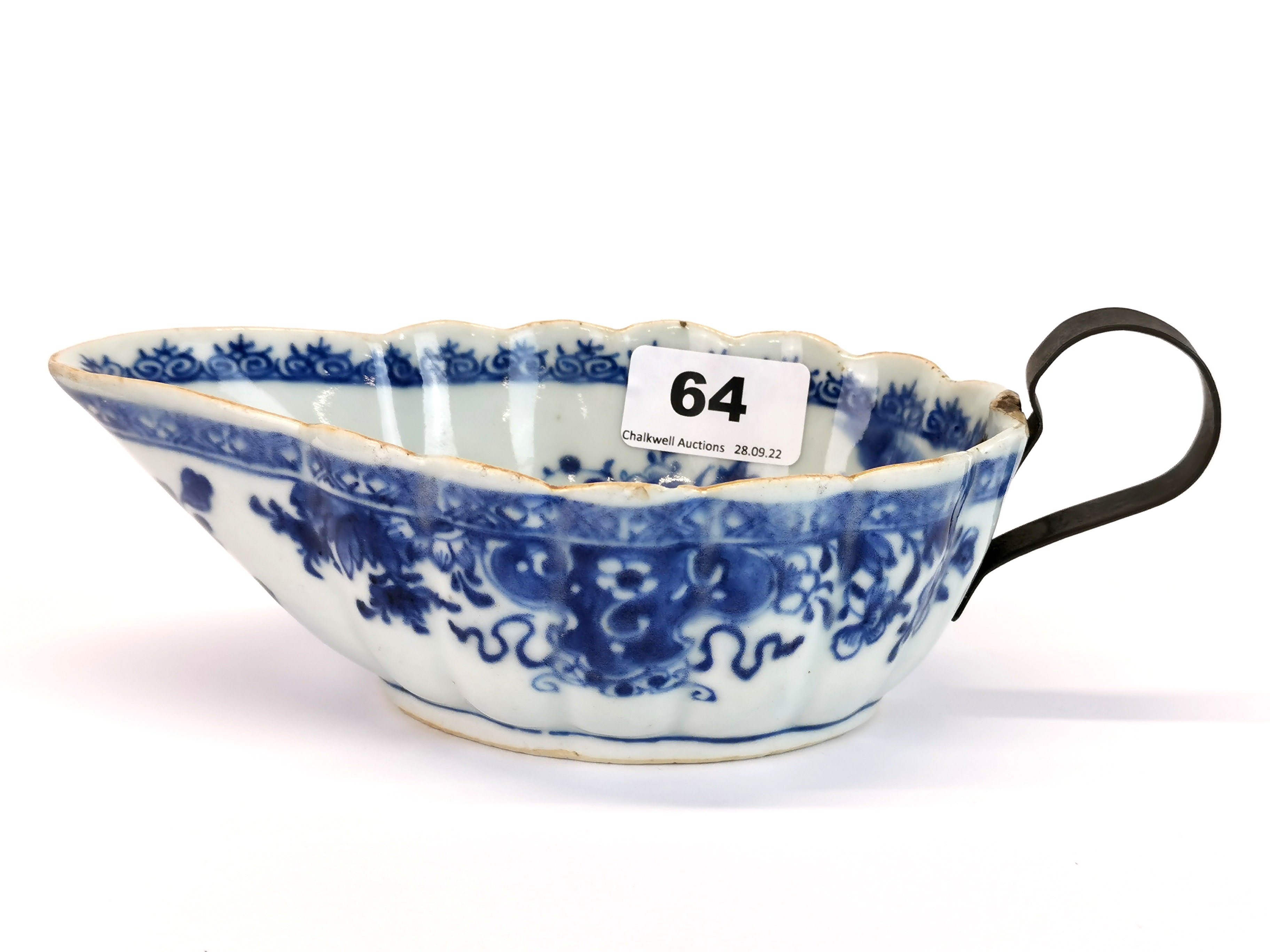 An 18thC Chinese export porcelain saucier, with an early replacement metal handle, L. 21cm. (