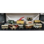 A group of 17 'O' gauge tin plate goods wagons.