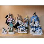 A pair of Royal Dux porcelain figures, with a group of further Continental porcelain figurines,