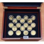 A case of 18 sterling silver gilt Channel Islands £5 proof coins.
