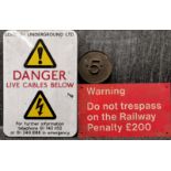 An enamelled metal London Underground sign, 28 x 40cm, together with a Railway warning sign and a