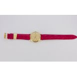 An Omega gold plated wrist watch on a red leather strap.