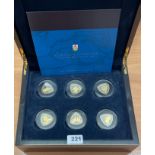 A cased 2007 6 silver gilt set of 3 dollar coins commemorating Bermuda ship wrecks.