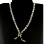 A 14ct yellow gold (stamped 585) and polished rock crystal bead necklace, L. 40cm.
