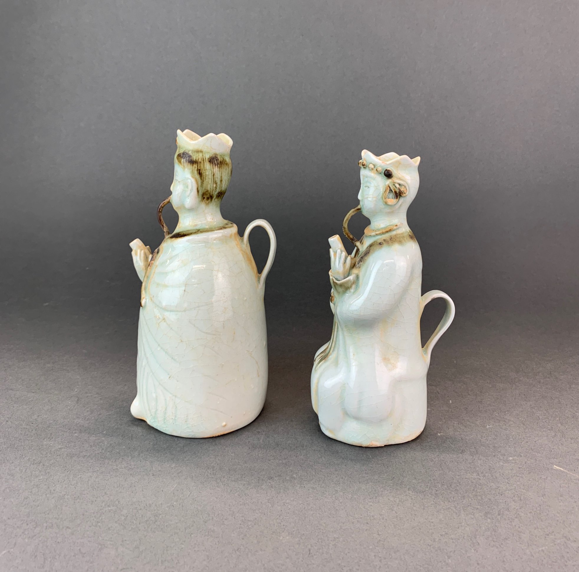 A pair of Chinese celadon glazed porcelain figural wine jugs, H. 19cm. - Image 2 of 4