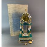 A boxed porcelain and gilt mantel clock, H. 49cm.