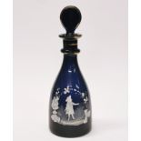 A 19th century blue glass decanter with Mary Gregory style decoration.