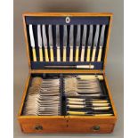 An oak cased silver plated cutlery set.