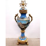 An impressive Sevres style gilt brass mounted porcelain urn with fixed cover, H. 108cm.