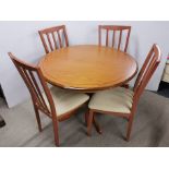 A contemporary circular extending dining table with six chairs, Dia. 103cm.