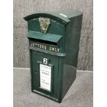 An Irish green reproduction metal letterbox, H. 57cm.