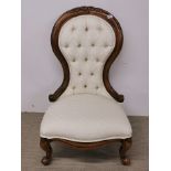 A Victorian style button backed nursing chair.