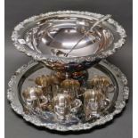 A large silver plated punch bowl, Dia. 45cm, with twelve silver plated punch cups and a large silver