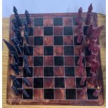 A Zimbabwe soapstone chess set, chief H. 12cm.