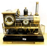 An impressive bronze and brass steam locomotive clock, 45 x 50cm.