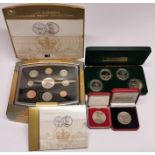 A United Kingdom 2002 executive proof coin set with a further group of coins.